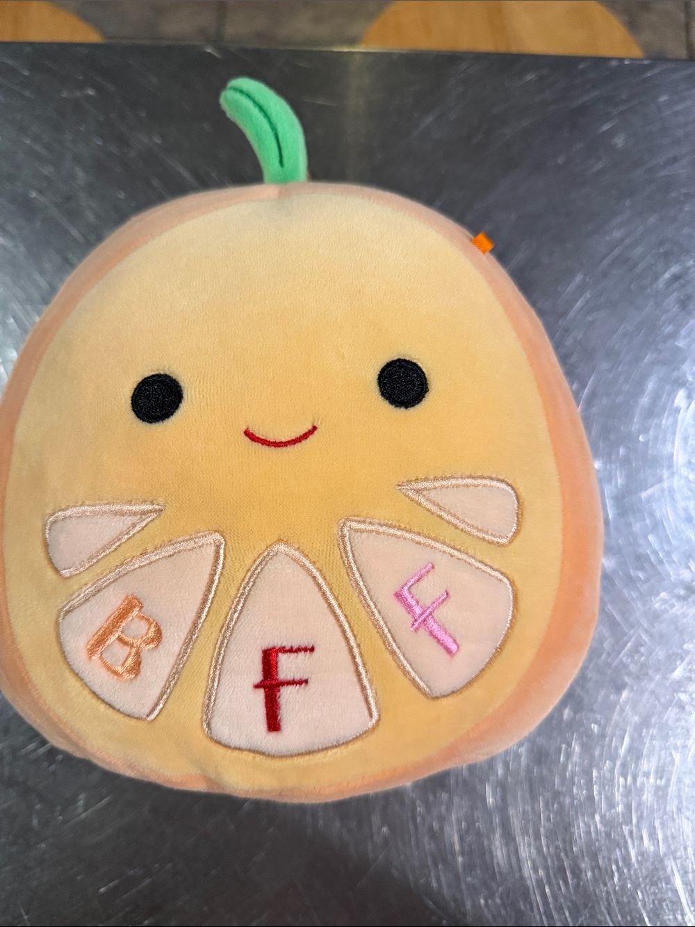 Squishmallows Yellow Peach Slice Plush with Green Stem